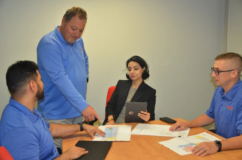 Advisor presenting a technology roadmap at a leadership table